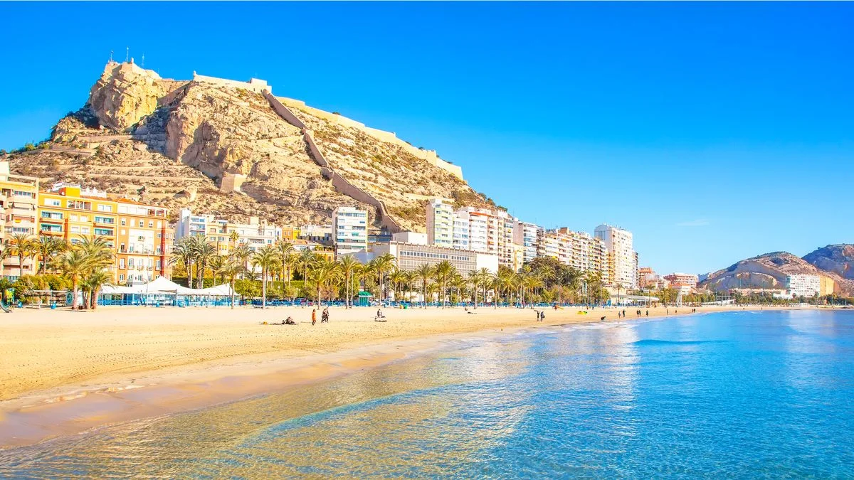 Panoramic view of Alicante beach and Santa Bárbara castle under the Spanish sun